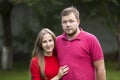 Close-up portrait of young attractive happy romantic smiling couple in love, pretty blond long-haired girl and handsome unshaven Royalty Free Stock Photo