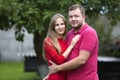 Close-up portrait of young attractive happy romantic smiling couple in love, pretty blond long-haired girl and handsome unshaven Royalty Free Stock Photo