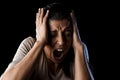 Close up portrait young attractive Latin woman screaming desperate screaming in primal fear emotion Royalty Free Stock Photo