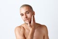 Close-up portrait of young attractive man posing shirtless, taking care after skin against white studio background Royalty Free Stock Photo