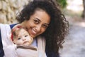 Close-up portrait of a young attractive mother carrying a baby in a sling carrier Royalty Free Stock Photo