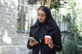 Close-up portrait of young and attractive muslim woman in hijab. Middle Eastern woman outdoor on the street. City Royalty Free Stock Photo