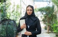 Close-up portrait of young and attractive muslim woman in hijab. Middle Eastern woman outdoor on the street. City Royalty Free Stock Photo