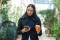 Close-up portrait of young and attractive muslim woman in hijab. Middle Eastern woman outdoor on the street. City Royalty Free Stock Photo