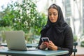 Close-up portrait of young and attractive muslim woman in hijab. Middle Eastern woman outdoor on the street. City Royalty Free Stock Photo