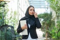 Close-up portrait of young and attractive muslim woman in hijab. Middle Eastern woman outdoor on the street. City Royalty Free Stock Photo