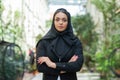 Close-up portrait of young and attractive muslim woman in hijab. Middle Eastern woman outdoor on the street. City Royalty Free Stock Photo