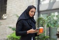 Close-up portrait of young and attractive muslim woman in hijab. Middle Eastern woman outdoor on the street. City Royalty Free Stock Photo