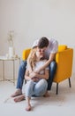 Close up portrait of young attractive romantic couple hugging and kissing, laying down on a bed, being loving with each other. Royalty Free Stock Photo