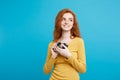 Close up Portrait young beautiful attractive ginger girl happy smiling with vintage camera and ready to travel. Isolated