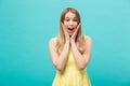 Close up Portrait young beautiful attractive girl shocking with something. Blue Pastel Background. Copy space.