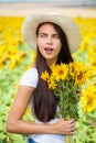 Portrait of a young beautiful girl in a field of sunflowers Royalty Free Stock Photo