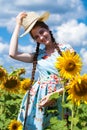 Portrait of a young beautiful girl in a field of sunflowers Royalty Free Stock Photo