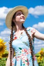 Portrait of a young beautiful girl in a field of sunflowers Royalty Free Stock Photo