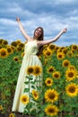 Portrait of a young beautiful girl in a field of sunflowers Royalty Free Stock Photo