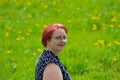 Close up portrait, Young beautiful red haired woman posing outdoors in sunny weather Royalty Free Stock Photo