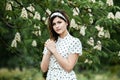 Close-up portrait of young beautiful Russian brunette girl at summer green park Royalty Free Stock Photo