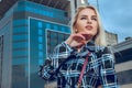 Close up portrait of young blonde woman with blue eyes outdoors Royalty Free Stock Photo