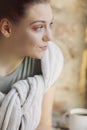 Close up portrait of young brunette girl looking out window with genuine interest Royalty Free Stock Photo