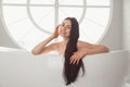 Close-up portrait of a young woman relaxing in the bathtub Royalty Free Stock Photo