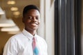 Close up portrait young businessman handsome African American black skin smiling standing at business office Royalty Free Stock Photo