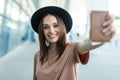 Portrait of young businesswoman at airport holding flight ticket and passport Royalty Free Stock Photo