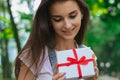 A close-up portrait of young charming girl with a gift Royalty Free Stock Photo