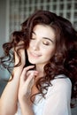 Close up portrait of a young curly girl with medium-brown hair. Royalty Free Stock Photo