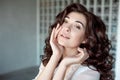 Close up portrait of a young curly girl with medium-brown hair. Royalty Free Stock Photo