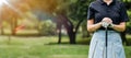 Close up portrait of Young female golf player wearing sportswear swinging on green field.Young woman golf player smiling and Royalty Free Stock Photo