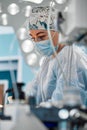 Close-up portrait of young female surgeon doctor at operation theater. Healthcare, medical education, emergency medical Royalty Free Stock Photo