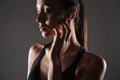 Close up portrait of a young fitness woman in earphones Royalty Free Stock Photo