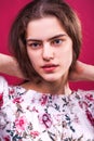 Portrait of young girl on isolated plum background