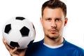 Close-up portrait of young handsome football player soccer posing on white isolated. Royalty Free Stock Photo