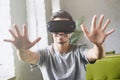 Young handsome man playing video games in smart 3d tech at home Royalty Free Stock Photo