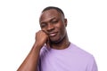 close-up portrait of young happy american man in lilac t-shirt on white background Royalty Free Stock Photo