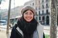 Close up portrait of young happy asian woman with beanie hat looking at camera with joyful attitude. Front view of girl Royalty Free Stock Photo