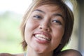 Close up portrait of young happy and beautiful expressive Asian woman smiling excited and nice in positive face expression Royalty Free Stock Photo