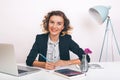 Close up portrait Young happy business woman sitting at her desk in an office.working on a laptop computer,planning a new project. Royalty Free Stock Photo