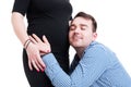 Close-up portrait of young husband hugging his pregnant wife bel Royalty Free Stock Photo