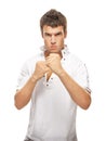 Close-up portrait of young man holding fists