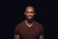 Close up portrait of young man isolated on black studio background Royalty Free Stock Photo