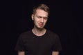 Close up portrait of young man isolated on black studio background Royalty Free Stock Photo