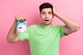 Close up portrait of young man stressed confused worried hand touch head when missed clock timer isolated on pink color Royalty Free Stock Photo