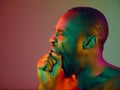 Close up portrait of a young naked african man looking at camera indoors Royalty Free Stock Photo