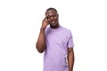 close-up portrait of a young pensive african man in a lilac t-shirt worried Royalty Free Stock Photo