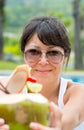 Close-up portrait young pretty woman drinking coconut cocktail Royalty Free Stock Photo