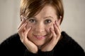 Close up portrait of young red hair sweet and beautiful Caucasian woman looking to the camera relaxed and tranquil smiling happy Royalty Free Stock Photo