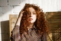 Portrait of a young red-haired woman with sad eyes Royalty Free Stock Photo