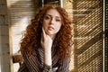 Portrait of a young red-haired woman with sad eyes Royalty Free Stock Photo